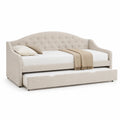 Cama nido tapizada en poliéster beige con cabecero capitoné y cama adicional