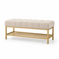 Banco beige de tela con base de metal dorado y estante